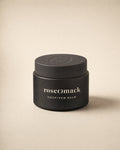 roseomack Hoof & paw balm, a squat matte black jar with the broken O pressed into its lid