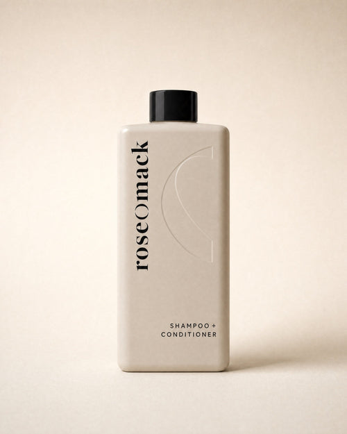 roseomack Shampoo & conditioner seen front on, the wordmark running vertically beside an embossed half O